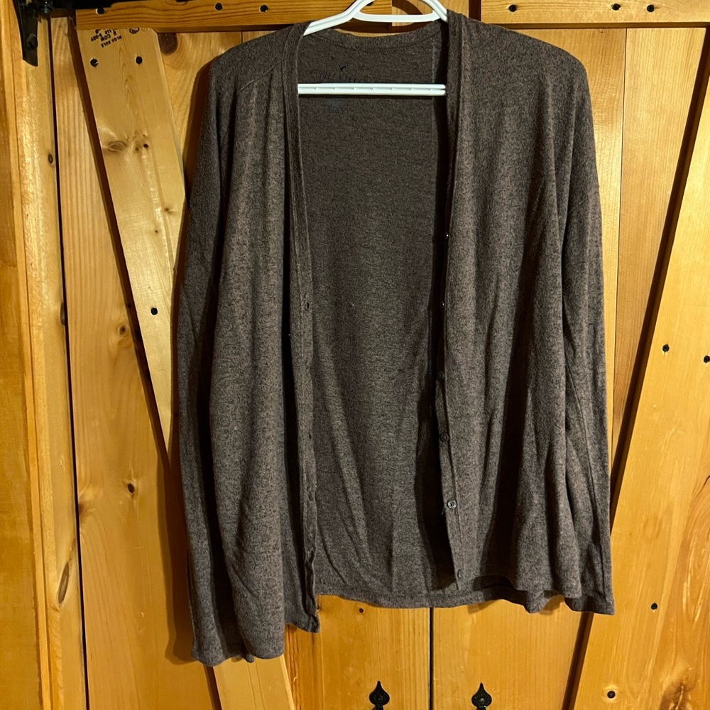 Light brown sweater/ cardigan.